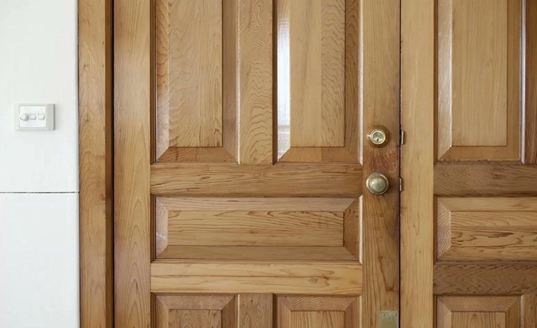 High-quality solid wooden door with natural finish and secure locking system for long-lasting use